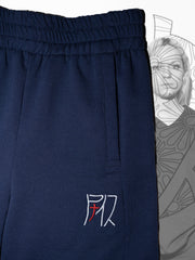 Nann, B-Jog bicolore en coton et plastique recyclé, détail de la poche passepoilée et de la broderie du logo Nann argenté et rouge