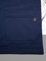 Nann, Haori, coton et plastique recyclés, focus sur la poche palquée de gauche, avec l'étiquette noire du logo